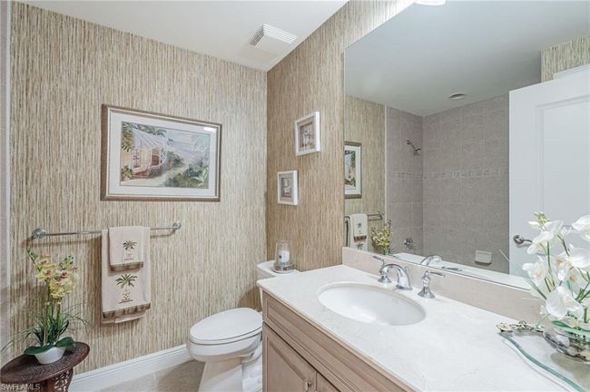 Bathroom featuring toilet and vanity | Image 38