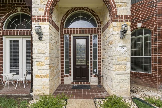 Doorway to property with brick siding and stone siding | Image 4