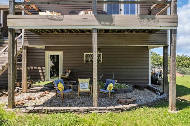Rear view of property featuring a balcony and a patio | Image 47