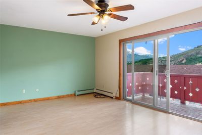 Open living room/kitchen with plentiful natural light and great mountain views! | Image 1