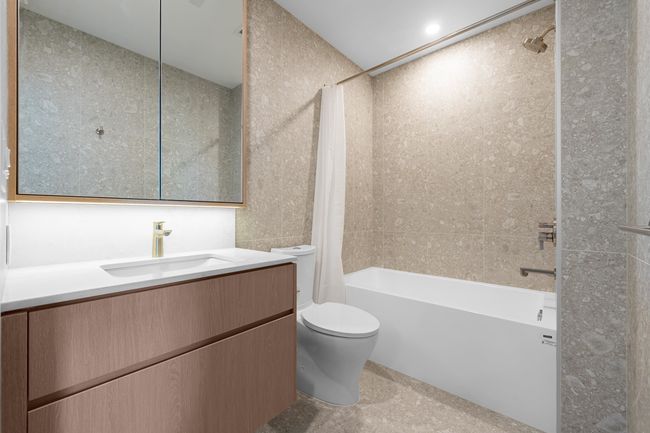 Full bath featuring shower / bath combo with shower curtain and vanity | Image 11