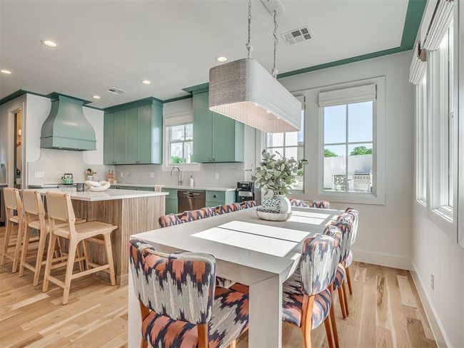 Dining room featuring light wood-style flooring, baseboards, and recessed lighting | Image 18