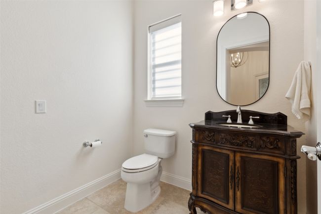 One of three full bathrooms with shower | Image 22