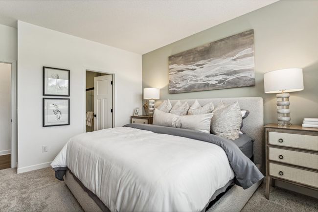 Photo is of the actual model. Find your retreat in the stunning primary bedroom. Enjoy the exclusivity of a private bath and walk-in closet. | Image 9