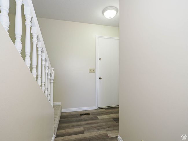 Stairway featuring wood finished floors and baseboards | Image 28