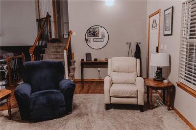 Great room featuring high vaulted ceilings, ceiling fan and carpet | Image 3