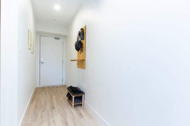 Hall with light wood-style flooring and baseboards | Image 14
