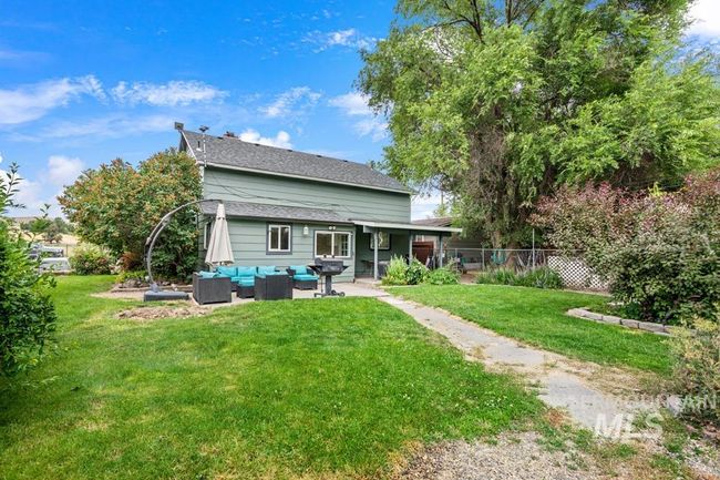 Rear view of property featuring an outdoor living space and a patio | Image 8
