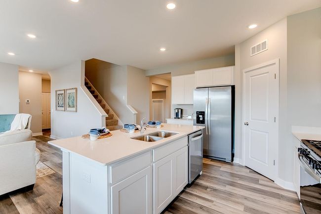 Kitchen has ample counter and cabinet space. The perfect space for making everyday meals or memorable special occasion dinners. Photo of model home, color & options may vary. | Image 6