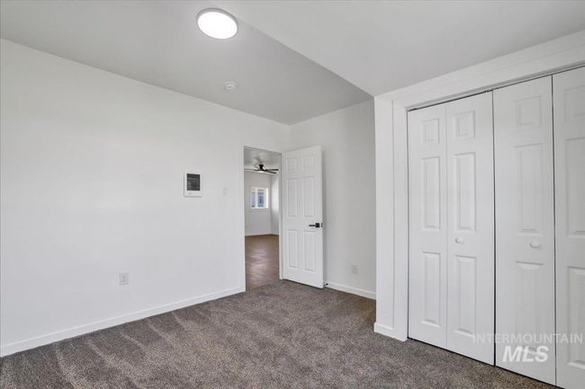 Unfurnished bedroom featuring carpet and a closet | Image 24