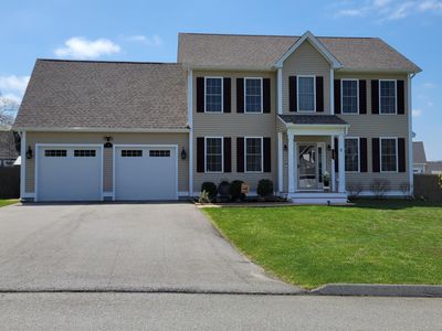 Front exterior with additional paved parking. | Image 1