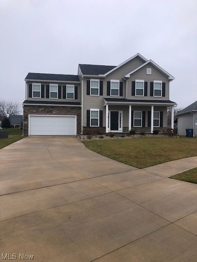 View of front of property with a garage and a front yard | Image 3