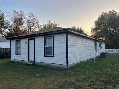 View of front of house featuring cooling unit and a yard | Image 2