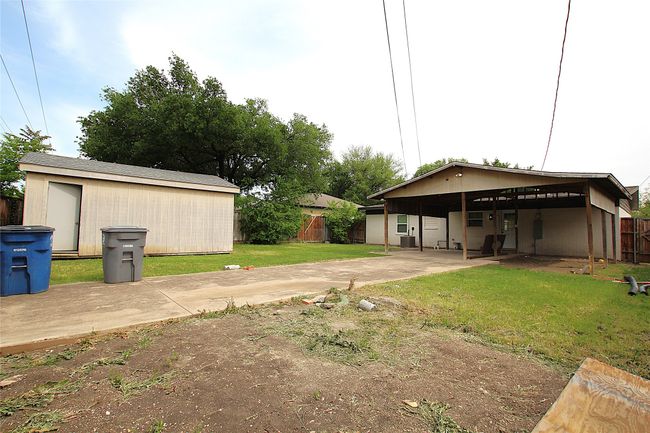 View of yard featuring an outdoor structure and fence | Image 18