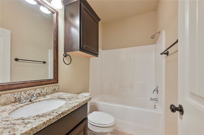 Full bath with vanity, shower / tub combination, and toilet | Image 19