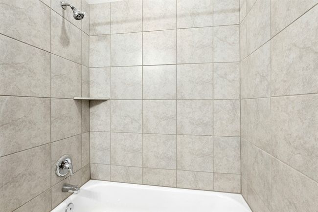 Bathroom featuring bathing tub / shower combination | Image 29