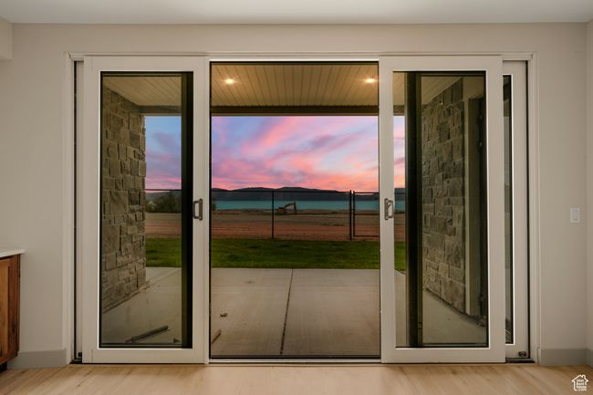 Doorway to outside with light wood finished floors and healthy amount of natural light | Image 64
