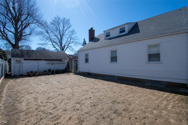 Back of property with fence private yard and a chimney | Image 27