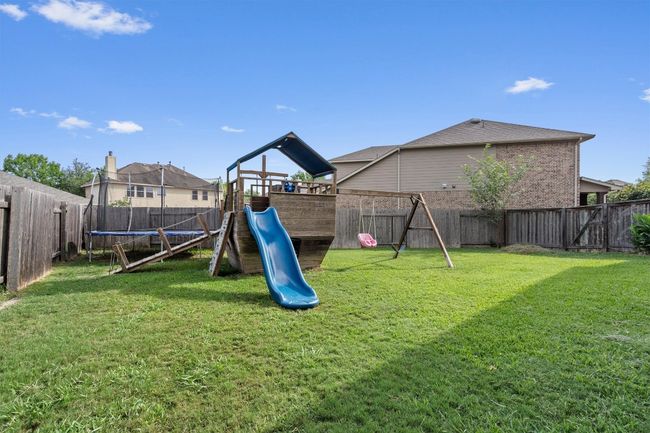 View of jungle gym with a trampoline | Image 35