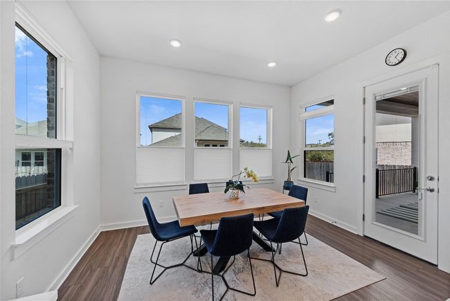 Dining area featuring baseboards, recessed lighting, and dark wood-type flooring | Image 7