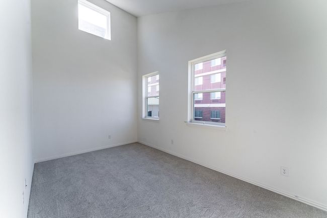 View of carpeted spare room | Image 8