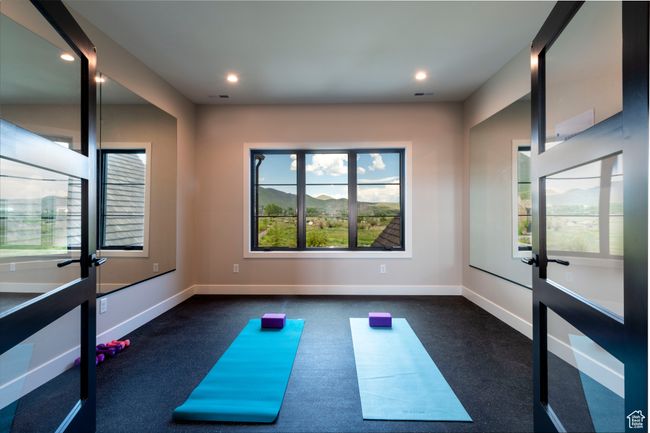 Exercise room featuring recessed lighting and dark colored carpet | Image 47