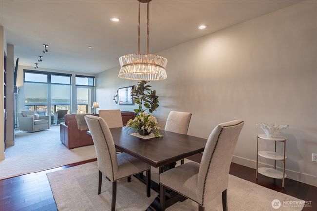 Easy transition from conversing to dining in the blended living and dining room. | Image 7
