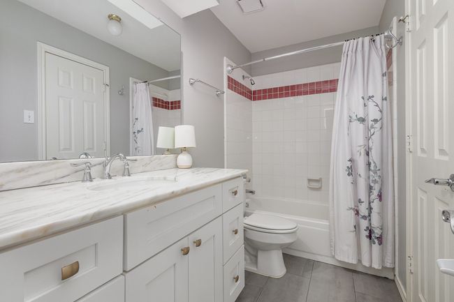 Ensuite bathroom with marble counters, walk-in closet | Image 26