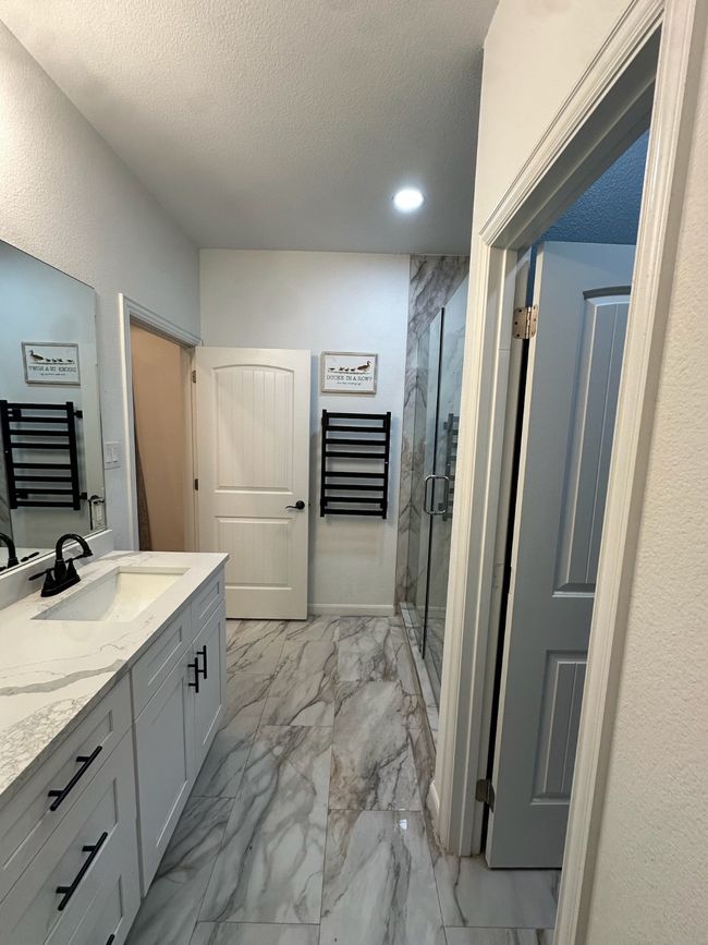 Carpeted office featuring baseboards and a ceiling fan | Image 7
