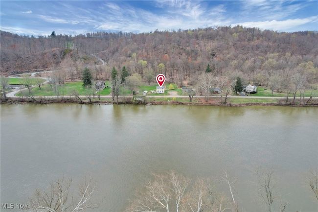 Water view featuring a heavily wooded area | Image 40