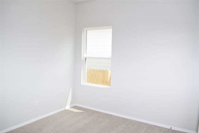 Carpeted empty room featuring baseboards | Image 15