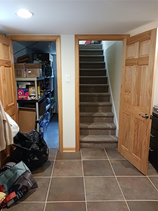 Staircase featuring tile patterned floors | Image 24
