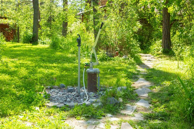 New well head with hand pump for power outages. | Image 48