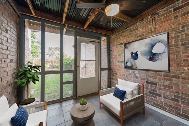 Sunroom / solarium featuring ceiling fan and beam ceiling | Image 9