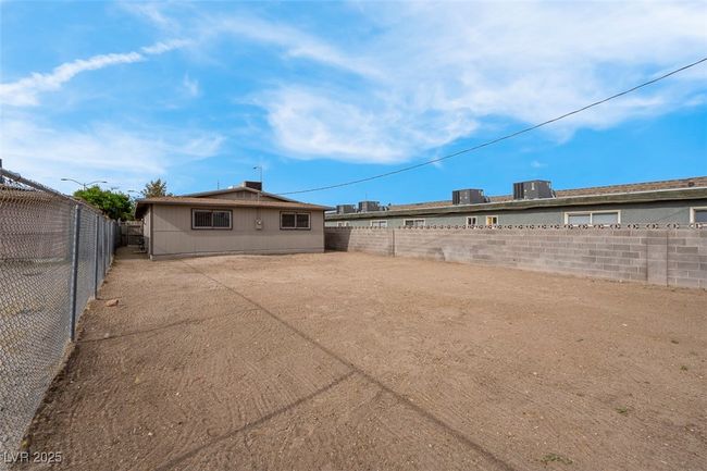 View of yard with a patio area and a fenced backyard | Image 35