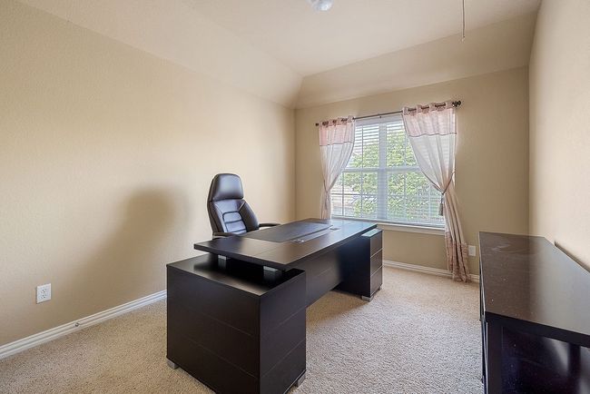 Office featuring baseboards, lofted ceiling, and light colored carpet | Image 9