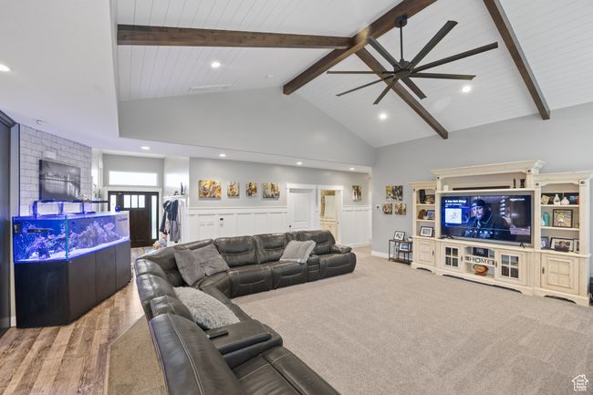 Living room featuring wood finished floors, ceiling fan, high vaulted ceiling, recessed lighting, and wood ceiling with exposed beams | Image 15