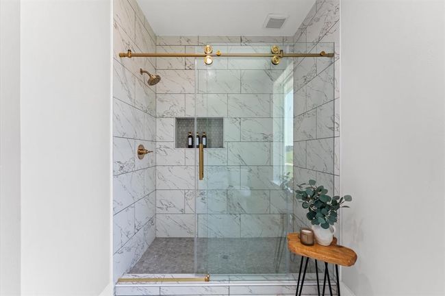 Large walk-in standing shower in the primary bath. | Image 18