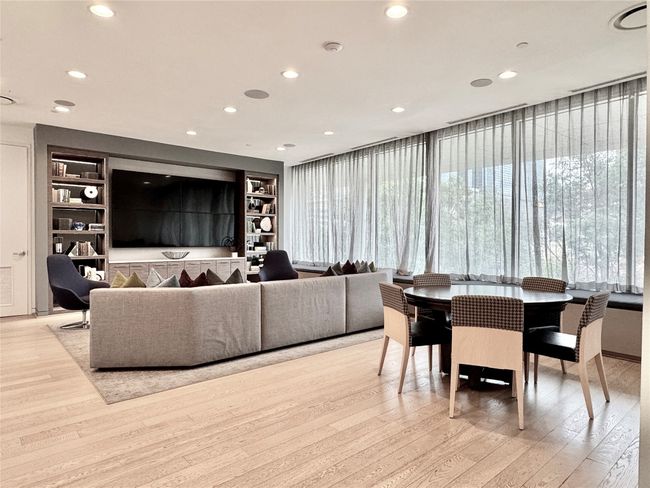 Living area featuring light wood-style flooring, built in features, and recessed lighting | Image 37