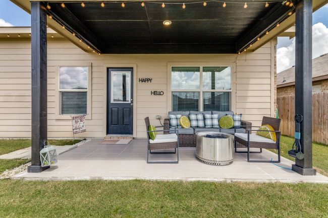 View of patio with an outdoor hangout area | Image 34
