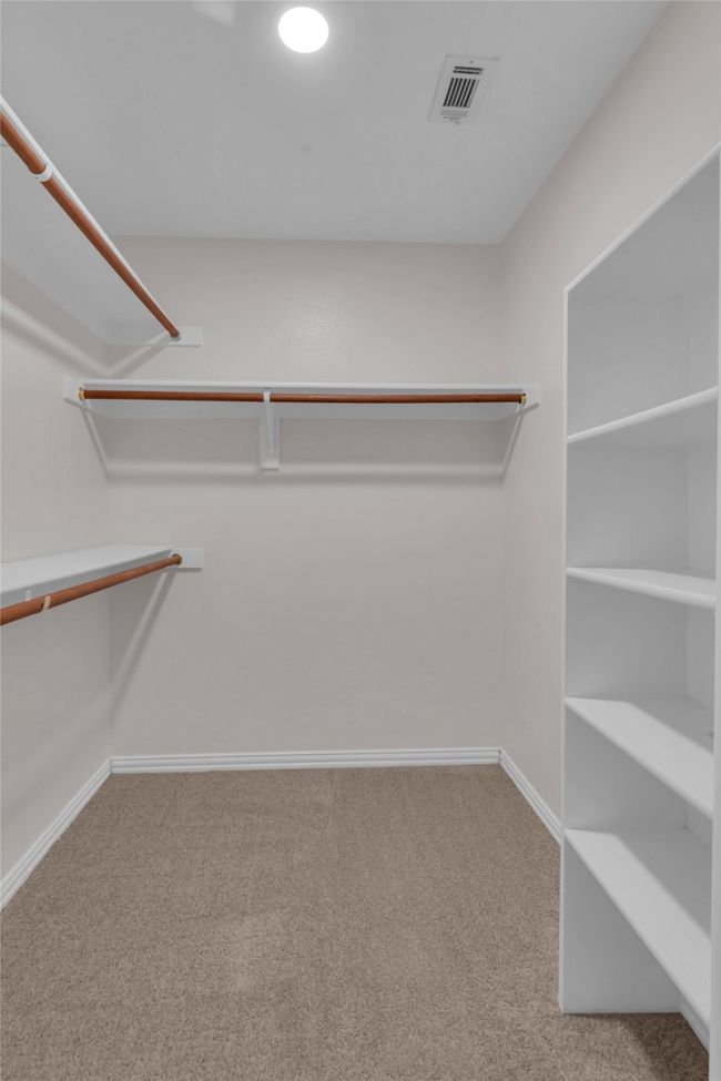 Spacious closet with carpet flooring | Image 28