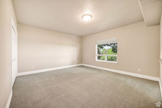 Carpeted spare room with baseboards and a textured ceiling | Image 30