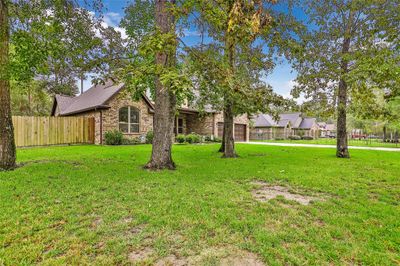 Front of home. Large mature trees in front yard. | Image 2