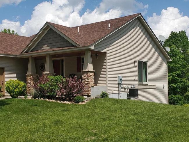 View of the healthy lawn and landscaping at front of home. | Image 47