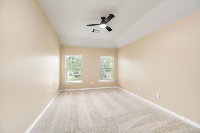 Cozy yet spacious, this secondary room offers flexibility for use as a guest room, nursery, or home office. | Image 28