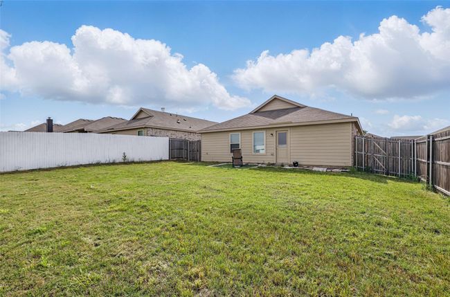 Back of house featuring a yard and a fenced backyard | Image 14