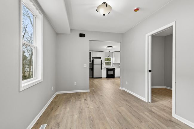 The main level offers an open concept between the kitchen, dining room, and living room. | Image 14