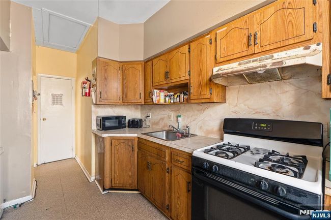 66 Harrison Ave, Home with 6 bedrooms, 2 bathrooms and null parking in Garfield NJ | Image 6