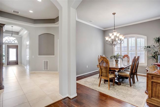 The end of the entry hall seamlessly connects the foyer, dedicated study and formal dining room. | Image 8