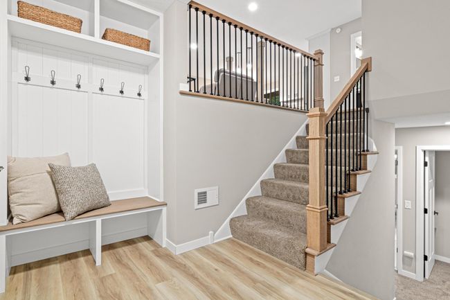 A large entry way greets you along with built-in bench/locker. | Image 12